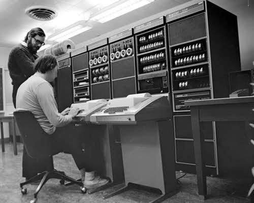 [ Dennis Ritchie and Ken Thompson at the PDP-11 ]